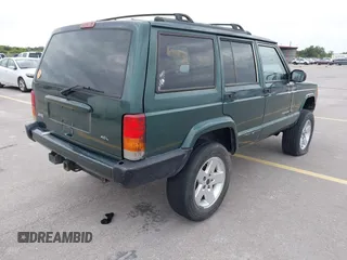 1999 Jeep Cherokee Sport z VIN 1J4FT68S1XL667138, wystawiony jako IAAI lot #42651020 z przebiegiem 200 324 mil mil oraz . Historia ofert i sprzedaży dostępna na DreamBid. Obrazek 4.