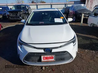 2023 Toyota Corolla Hybrid LE with VIN JTDBCMFE1PJ011085, listed as a IAAI auction lot 41340297 with 34,437 mi miles. Bid and sale history available at carsss.com. Image 13.