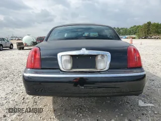2001 Lincoln Town Car Executive z VIN 1LNHM81W11Y647756, wystawiony jako Copart lot #54741135 z przebiegiem 191 580 mil mil oraz Szkoda całkowita • Salvage title. Historia ofert i sprzedaży dostępna na DreamBid. Obrazek 6.