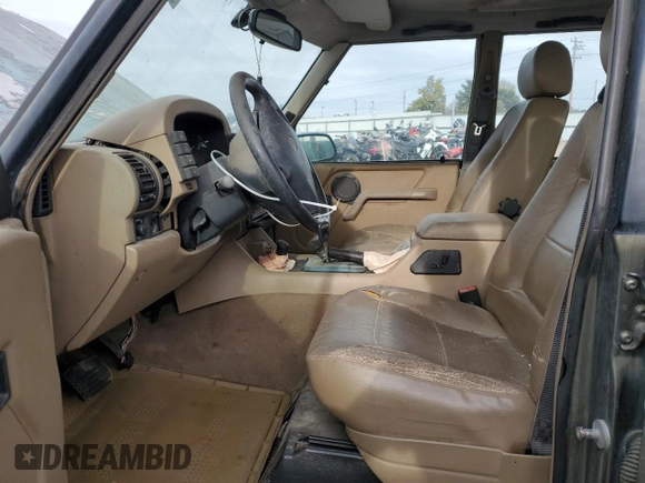 1997 Land Rover Discovery SD z VIN SALJY1249VA705067, wystawiony jako Copart lot #77047054 z przebiegiem 146 965 mil mil oraz Czysty tytuł • Clean title. Historia ofert i sprzedaży dostępna na DreamBid. Obrazek 7.