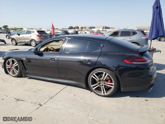 2014 Porsche Panamera GTS with VIN WP0AF2A73EL083388, listed as a Copart auction lot 74312004 with 106,386 mi miles and Salvage Title. Bid and sale history available at carsss.com. Image 2.