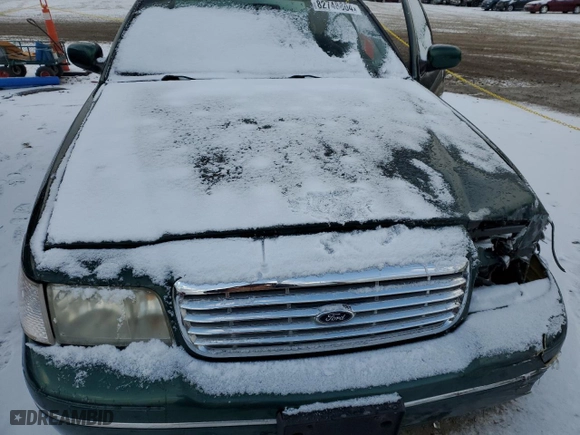 2000 Ford Crown Victoria with VIN 2FAFP73WXYX157746, listed as a Copart auction lot 82748804 with 56,820 mi miles and Salvage Title. Bid and sale history available at carsss.com. Image 11.