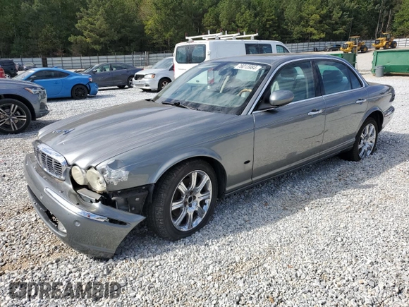 2006 Jaguar XJ with VIN SAJWA71B06SH03941, listed as a Copart auction lot 76013984 with 0 mi miles and Salvage Title. Bid and sale history available at carsss.com. Image 1.