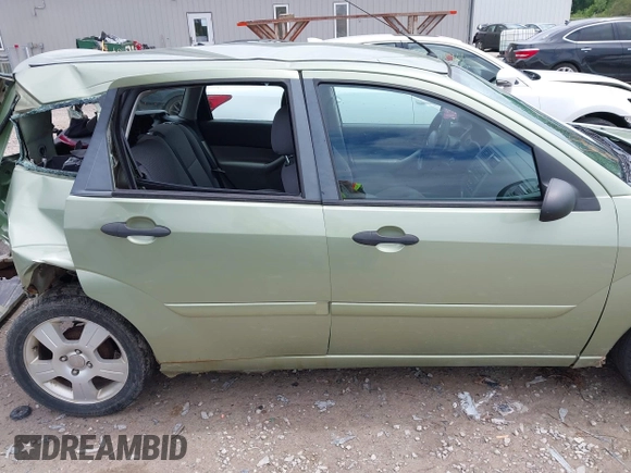 2007 Ford Focus S z VIN 1FAHP37N47W278284, wystawiony jako IAAI lot #42246383 z przebiegiem 164 830 mil mil oraz . Historia ofert i sprzedaży dostępna na DreamBid. Obrazek 14.
