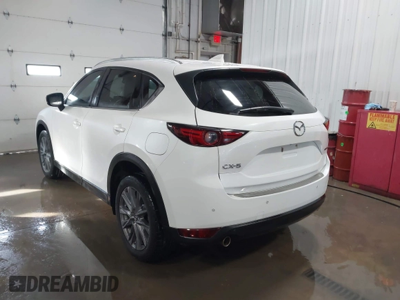 2021 Mazda CX-5 Grand Touring with VIN JM3KFADM3M0312143, listed as a IAAI auction lot 41606582 with 46,515 mi miles. Bid and sale history available at carsss.com. Image 3.