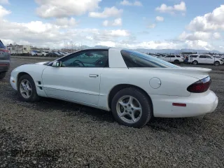 2001 Pontiac Firebird Formula z VIN 2G2FV22G112116104, wystawiony jako Copart lot #47191405 z przebiegiem 66 990 mil mil oraz Szkody całkowita. Historia ofert i sprzedaży dostępna na DreamBid. Obrazek 2.