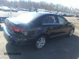 2016 Volkswagen Jetta Sedan 1.4T SE with VIN 3VWD67AJXGM242539, listed as a IAAI auction lot 38948493 with 121,876 mi miles. Bid and sale history available at carsss.com. Image 4.