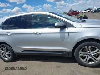 2015 Ford Edge Titanium z VIN 2FMTK4K95FBB47962, wystawiony jako IAAI lot #42234894 z przebiegiem Nie podano mil oraz . Historia ofert i sprzedaży dostępna na DreamBid. Obrazek 13.