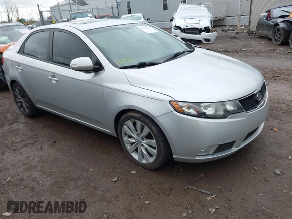 2010 Kia Forte SX with VIN KNAFW4A39A5230517, listed as a IAAI auction lot 41953297 with 154,711 mi miles. Bid and sale history available at carsss.com. Image 1.