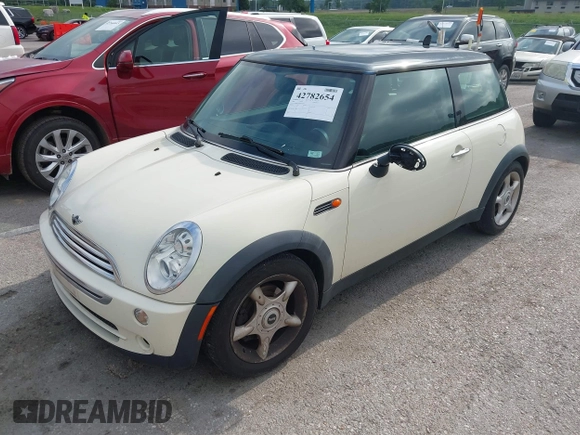 2006 MINI Hardtop with VIN WMWRC33566TK73763, listed as a IAAI auction lot 42782654 with 103,751 mi miles and . Bid and sale history available at DreamBid. Image 2.