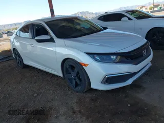 2020 Honda Civic LX with VIN 19XFC2F66LE007328, listed as a IAAI auction lot 41852111 with 135,956 mi miles and . Bid and sale history available at DreamBid. Image 1.