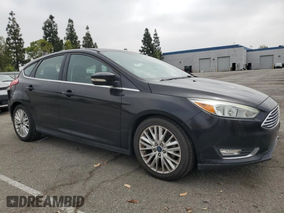 2015 Ford Focus Titanium z VIN 1FADP3N25FL324390, wystawiony jako Copart lot #59801805 z przebiegiem 97 615 mil mil oraz Szkoda całkowita • Salvage title. Historia ofert i sprzedaży dostępna na DreamBid. Obrazek 4.