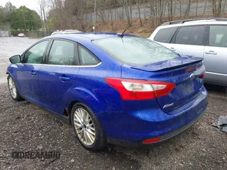 2014 Ford Focus Titanium with VIN 1FADP3J28EL240911, listed as a IAAI auction lot 42082812 with 144,625 mi miles. Bid and sale history available at carsss.com. Image 3.