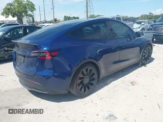 2023 Tesla Model Y Performance with VIN 7SAYGDEF9PF582908, listed as a IAAI auction lot 41930957 with 52,857 mi miles and . Bid and sale history available at DreamBid. Image 4.
