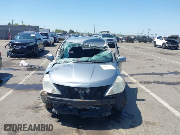 2009 Nissan Versa 1.8 S with VIN 3N1BC11E09L449780, listed as a IAAI auction lot 42034977 with 180,680 mi miles. Bid and sale history available at carsss.com. Image 6.