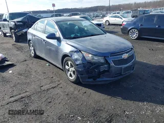 2014 Chevrolet Cruze 1LT with VIN 1G1PC5SB9E7323441, listed as a IAAI auction lot 41400152 with 134,594 mi miles and . Bid and sale history available at DreamBid. Image 1.