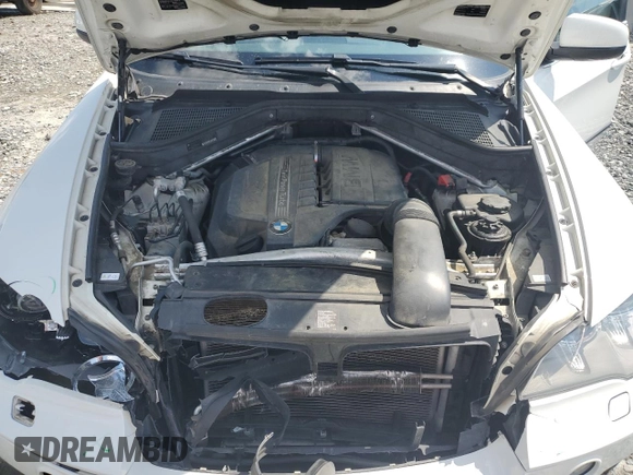2013 BMW X5 xDrive35i z VIN 5UXZV4C52D0G56473, wystawiony jako Copart lot #56563345 z przebiegiem 156 884 mil mil oraz Szkoda całkowita • Salvage title. Historia ofert i sprzedaży dostępna na DreamBid. Obrazek 12.