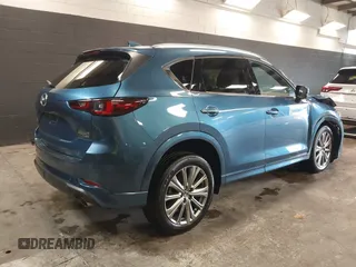 2023 Mazda CX-5 Signature with VIN JM3KFBXY4P0120187, listed as a IAAI auction lot 41706264 with 9,402 mi miles and . Bid and sale history available at carsss.com. Image 4.
