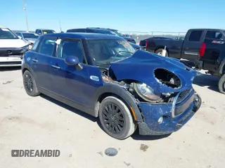 2015 MINI Hardtop 4 Door S z VIN WMWXU3C51F2B59506, wystawiony jako IAAI lot #41718905 z przebiegiem 81 942 mil mil oraz . Historia ofert i sprzedaży dostępna na DreamBid. Obrazek 1.