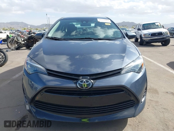 2018 Toyota Corolla L with VIN 5YFBURHEXJP806632, listed as a IAAI auction lot 41933984 with 70,091 mi miles and . Bid and sale history available at DreamBid. Image 13.