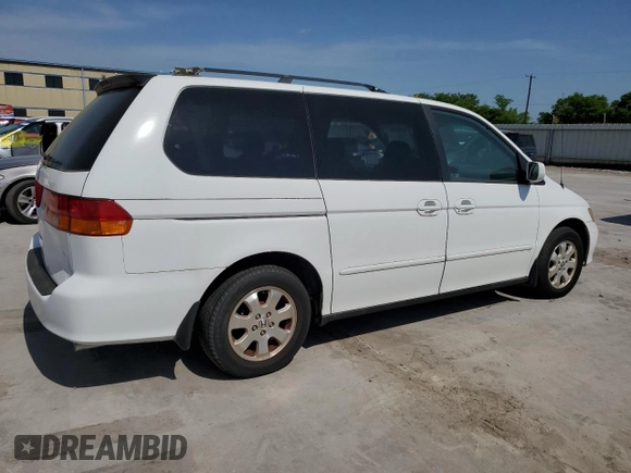 2004 Honda Odyssey EX-L with VIN 5FNRL18974B092979, listed as a Copart auction lot 52429055 with 106,515 mi miles and Clean Title. Bid and sale history available at DreamBid. Image 3.