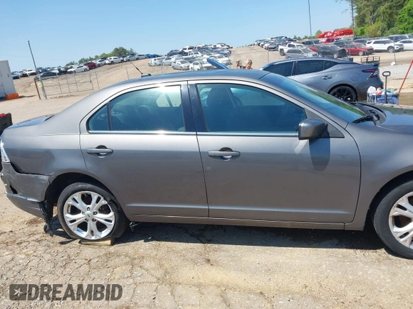 2012 Ford Fusion SE z VIN 3FAHP0HA4CR232641, wystawiony jako IAAI lot #42057070 z przebiegiem 180 793 mil mil oraz . Historia ofert i sprzedaży dostępna na DreamBid. Obrazek 13.