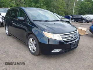 2013 Honda Odyssey Touring with VIN 5FNRL5H98DB003783, listed as a IAAI auction lot 42794056 with 209,392 mi miles and . Bid and sale history available at DreamBid. Image 1.