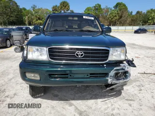 2000 Toyota Land Cruiser with VIN JT3HT05J8Y0085990, listed as a Copart auction lot 76706864 with 329,562 mi miles and Salvage Title. Bid and sale history available at carsss.com. Image 5.
