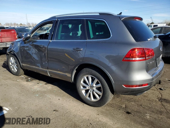 2012 Volkswagen Touareg Lux z VIN WVGEK9BPXCD011322, wystawiony jako Copart lot #87062254 z przebiegiem 110 985 mil mil oraz Szkoda całkowita • Salvage title. Historia ofert i sprzedaży dostępna na DreamBid. Obrazek 2.