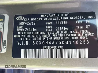 2013 Kia Optima EX with VIN 5XXGN4A75DG148233, listed as a IAAI auction lot 41878061 with 124,066 mi miles. Bid and sale history available at carsss.com. Image 9.
