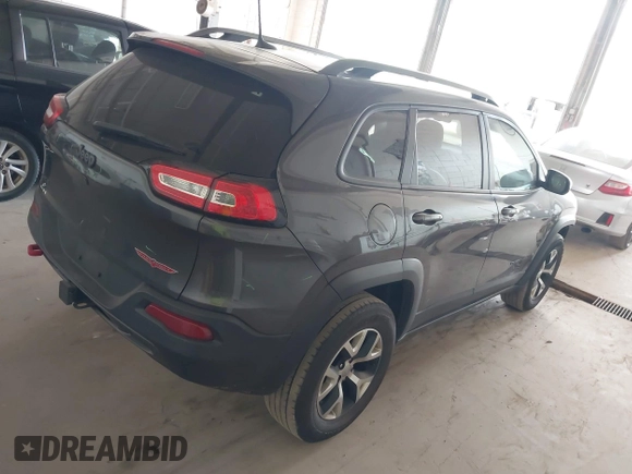 2016 Jeep Cherokee Trailhawk with VIN 1C4PJMBS0GW169184, listed as a IAAI auction lot 42255346 with 152,802 mi miles and . Bid and sale history available at DreamBid. Image 4.