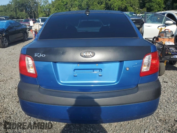 2009 Kia Rio LX with VIN KNADE223296515613, listed as a Copart auction lot 62008194 with 143,238 mi miles and Salvage Title. Bid and sale history available at carsss.com. Image 6.