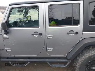 2013 Jeep Wrangler Unlimited Rubicon z VIN 1C4BJWFG7DL667083, wystawiony jako IAAI lot #42016912 z przebiegiem 148 933 mil mil oraz . Historia ofert i sprzedaży dostępna na DreamBid. Obrazek 14.
