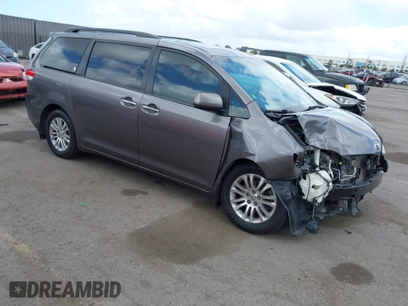 2014 Toyota Sienna XLE with VIN 5TDYK3DC7ES517206, listed as a IAAI auction lot 41945572 with 128,743 mi miles and . Bid and sale history available at DreamBid. Image 1.
