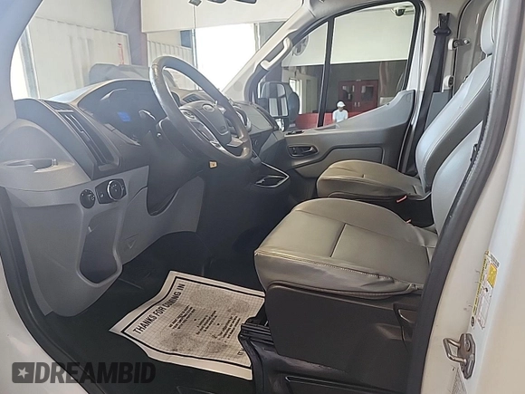 2016 Ford Transit Cargo with VIN 1FTYE1ZM0GKB06690, listed as a IAAI auction lot 42677893 with 295,974 mi miles and . Bid and sale history available at DreamBid. Image 2.