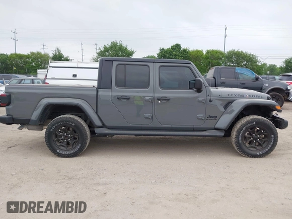 2022 Jeep Gladiator Willys with VIN 1C6JJTAMXNL137237, listed as a IAAI auction lot 41947651 with 55,199 mi miles and . Bid and sale history available at DreamBid. Image 13.