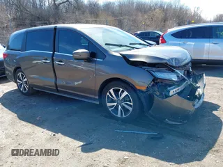 2022 Honda Odyssey Touring z VIN 5FNRL6H84NB012947, wystawiony jako IAAI lot #41881820 z przebiegiem 54 719 mil mil oraz . Historia ofert i sprzedaży dostępna na DreamBid. Obrazek 1.