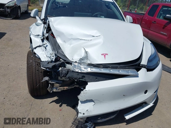 2022 Tesla Model Y Long Range z VIN 7SAYGDEE9NF509655, wystawiony jako IAAI lot #42433796 z przebiegiem 46 936 mil mil oraz . Historia ofert i sprzedaży dostępna na DreamBid. Obrazek 21.