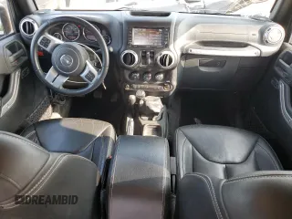 2015 Jeep Wrangler Rubicon Hard Rock z VIN 1C4BJWCG9FL714606, wystawiony jako Copart lot #68521014 z przebiegiem 35 187 mil mil oraz Szkoda całkowita • Salvage title. Historia ofert i sprzedaży dostępna na DreamBid. Obrazek 8.