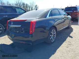 2013 Cadillac XTS Luxury with VIN 2G61R5S33D9184878, listed as a IAAI auction lot 41644213 with 113,293 mi miles. Bid and sale history available at carsss.com. Image 4.
