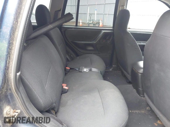 2003 Jeep Grand Cherokee Laredo z VIN 1J4GW48S73C553686, wystawiony jako IAAI lot #42278695 z przebiegiem 154 374 mil mil oraz . Historia ofert i sprzedaży dostępna na DreamBid. Obrazek 8.