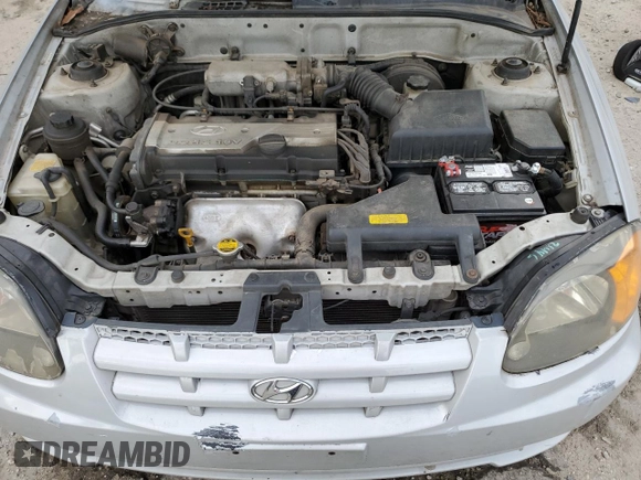 2003 Hyundai Accent GL z VIN KMHCG35CX3U270374, wystawiony jako Copart lot #47240325 z przebiegiem 122 739 mil mil oraz Szkoda całkowita • Salvage title. Historia ofert i sprzedaży dostępna na DreamBid. Obrazek 11.