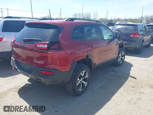 2016 Jeep Cherokee Trailhawk with VIN 1C4PJMBS9GW237059, listed as a IAAI auction lot 42079788 with 114,513 mi miles. Bid and sale history available at carsss.com. Image 4.