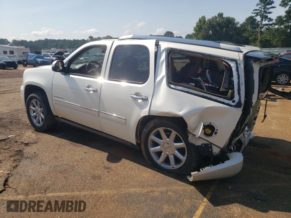 2013 GMC Yukon Denali with VIN 1GKS2EEF9DR311929, listed as a Copart auction lot 63810874 with 122,356 mi miles and Salvage Title. Bid and sale history available at carsss.com. Image 2.