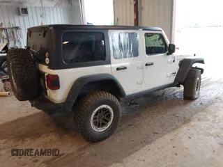 2022 Jeep Wrangler Unlimited Rubicon with VIN 1C4JJXFM0NW154202, listed as a IAAI auction lot 42400067 with 60,486 mi miles and . Bid and sale history available at DreamBid. Image 4.