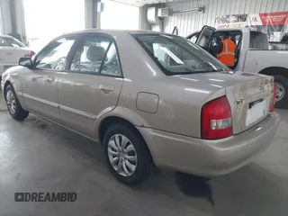 2000 Mazda Protege DX with VIN JM1BJ2221Y0239987, listed as a IAAI auction lot 42092488 with 140,756 mi miles and . Bid and sale history available at DreamBid. Image 3.