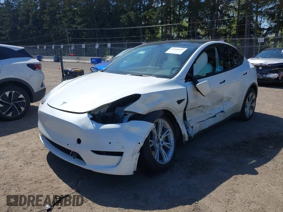 2022 Tesla Model Y Long Range z VIN 7SAYGDEE7NF418223, wystawiony jako IAAI lot #42046651 z przebiegiem 18 724 mil mil oraz . Historia ofert i sprzedaży dostępna na DreamBid. Obrazek 20.