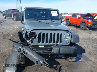 2015 Jeep Wrangler Unlimited Willys Wheeler with VIN 1C4BJWDG4FL589822, listed as a IAAI auction lot 41732614 with 149,112 mi miles and . Bid and sale history available at DreamBid. Image 6.