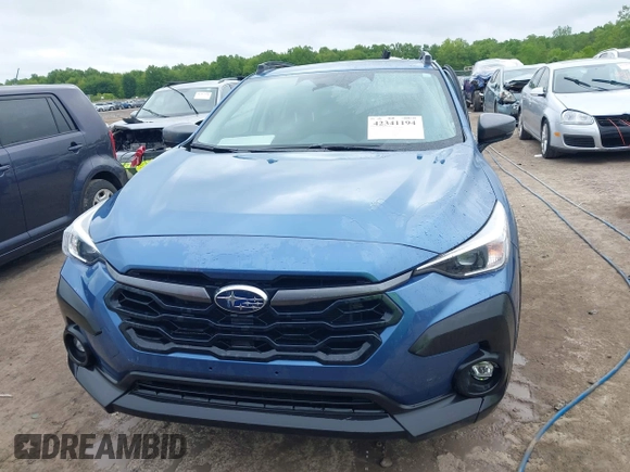 2024 Subaru Crosstrek Premium z VIN JF2GUADC6RH338290, wystawiony jako IAAI lot #42341194 z przebiegiem 10 379 mil mil oraz . Historia ofert i sprzedaży dostępna na DreamBid. Obrazek 13.
