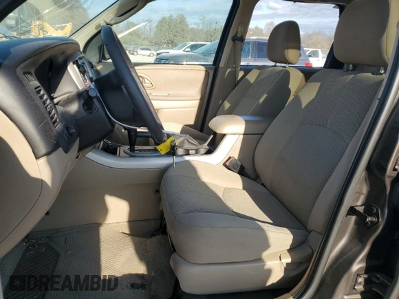 2006 Mazda Tribute S with VIN 4F2YZ04116KM23873, listed as a Copart auction lot 79926084 with 67,142 mi miles and Salvage Title. Bid and sale history available at DreamBid. Image 7.